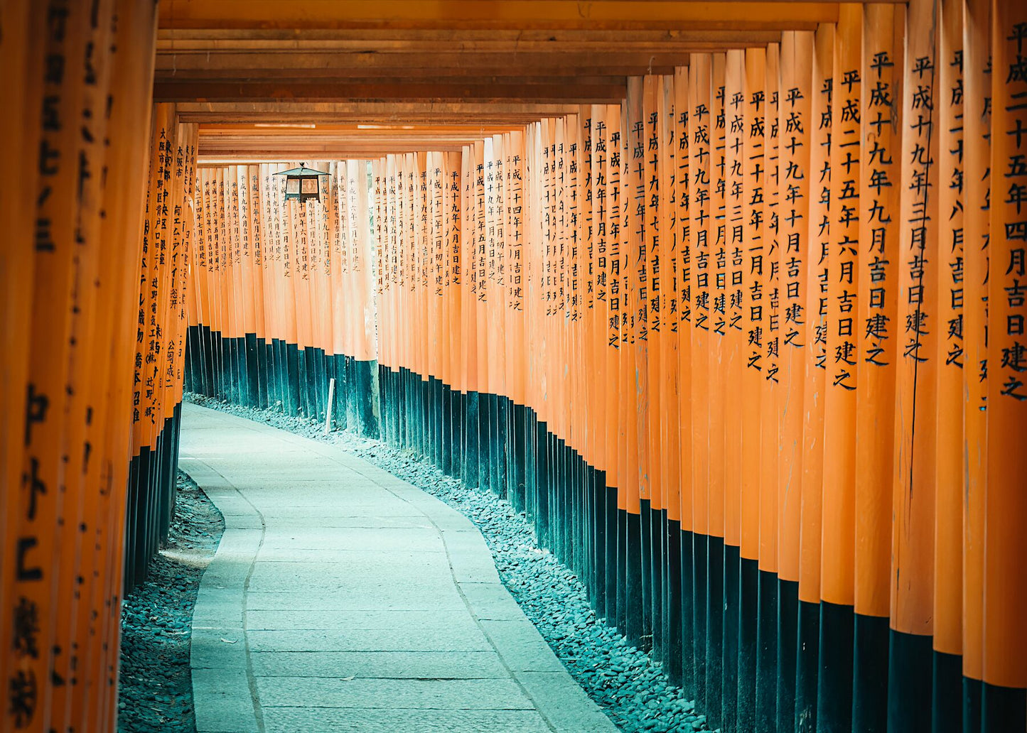 A mesmerizing tunnel of vermilion torii gates at Fushimi Inari Shrine, Kyoto, Japan.