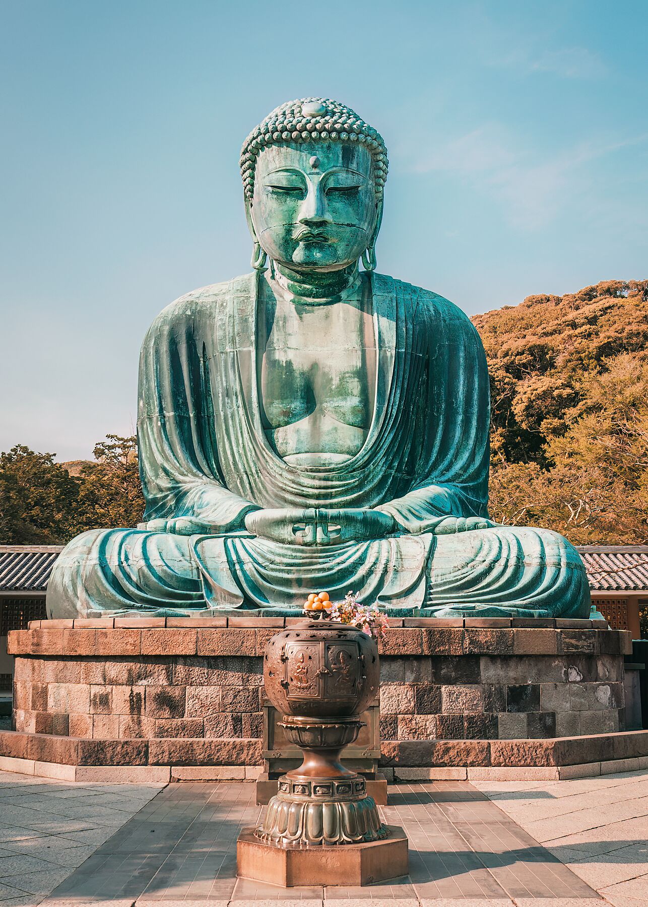 A serene view of the Great Buddha of Kamakura, Japan, capturing its timeless presence and weathered bronze details.