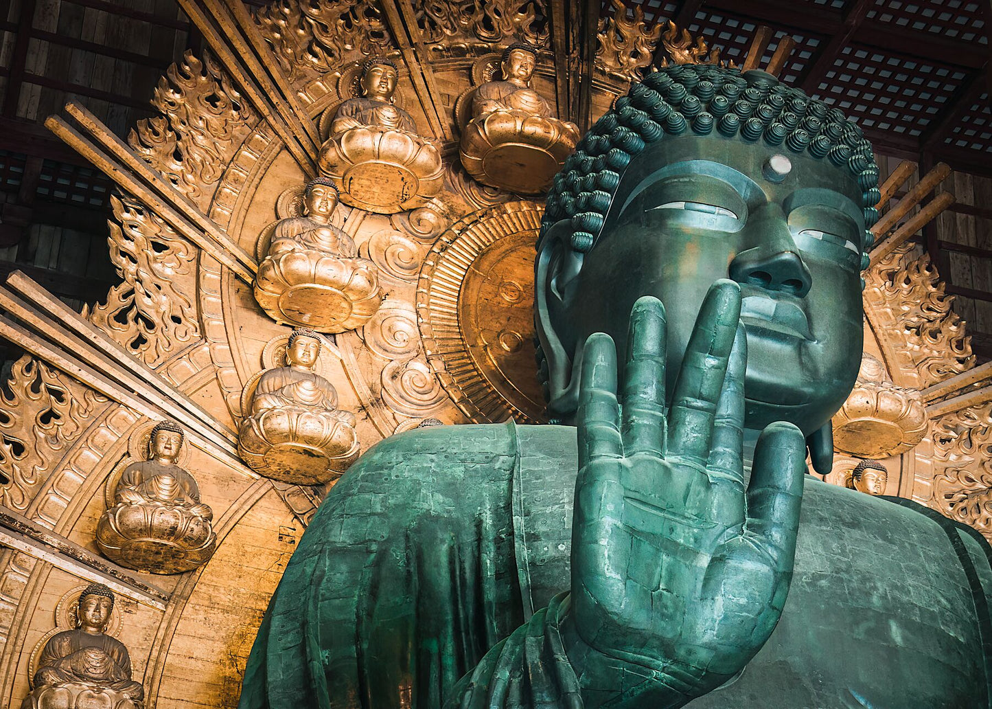 Close-up view of the Great Buddha of Nara, Japan, capturing the statue’s timeless presence and weathered details.
